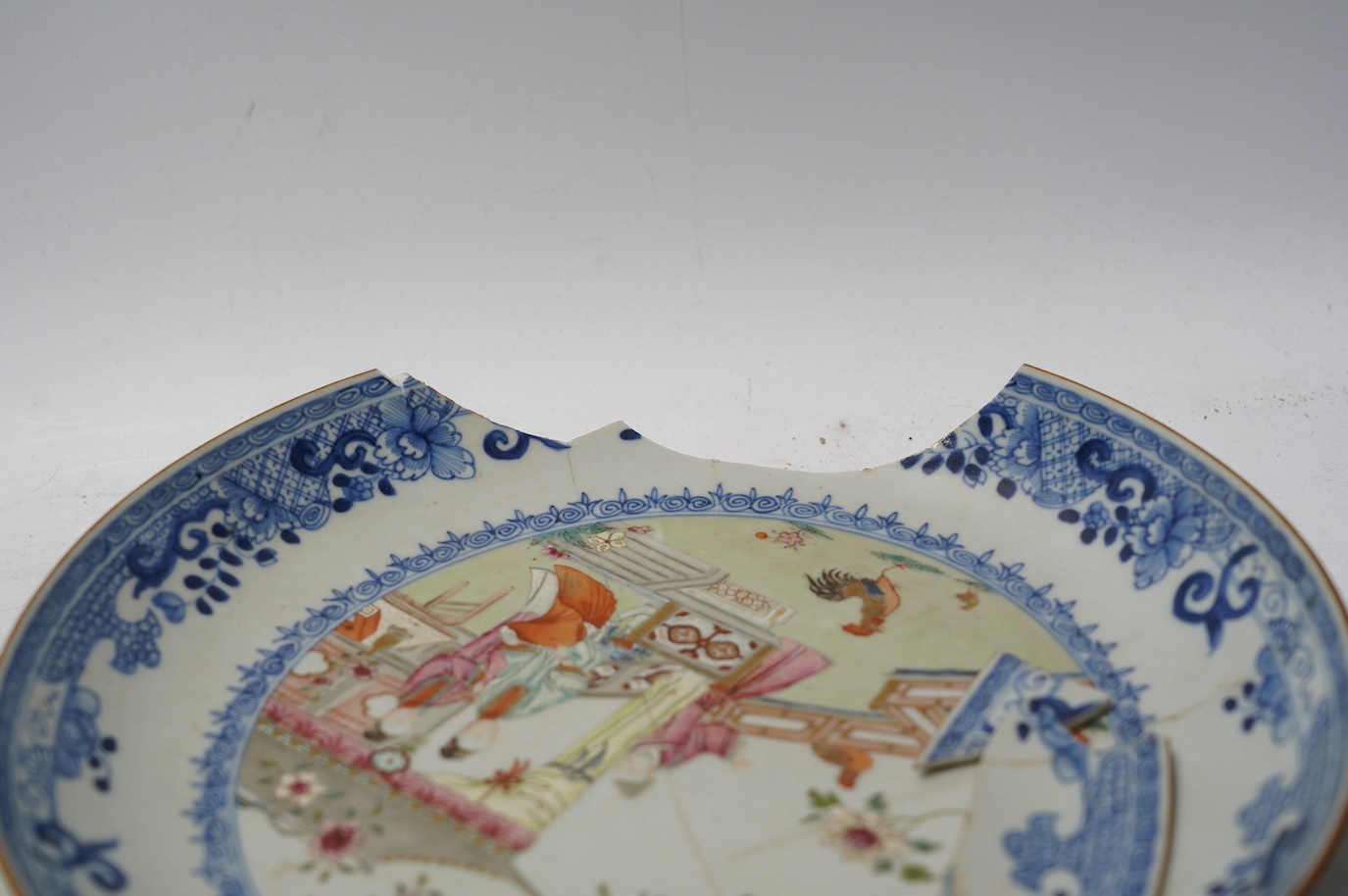 Three Japanese Kakiemon style blue and white dishes and an 18th century Chinese famille rose dish. Condition - varies